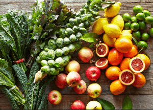 a group of fruits and vegetables on a wood surface Healthy Weight Loss Diets Greenford