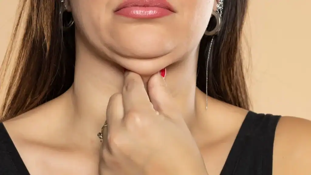 An image of a woman with double chin, sad, worried : Non Surgical Double Chin Removal Treatment in Greenford, UK